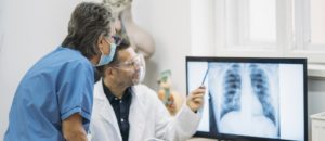 doctor and a nurse looking at lungs x-ray