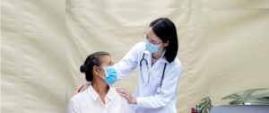 female doctor supporting female patient