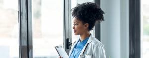 clinical trial nurse looking out window