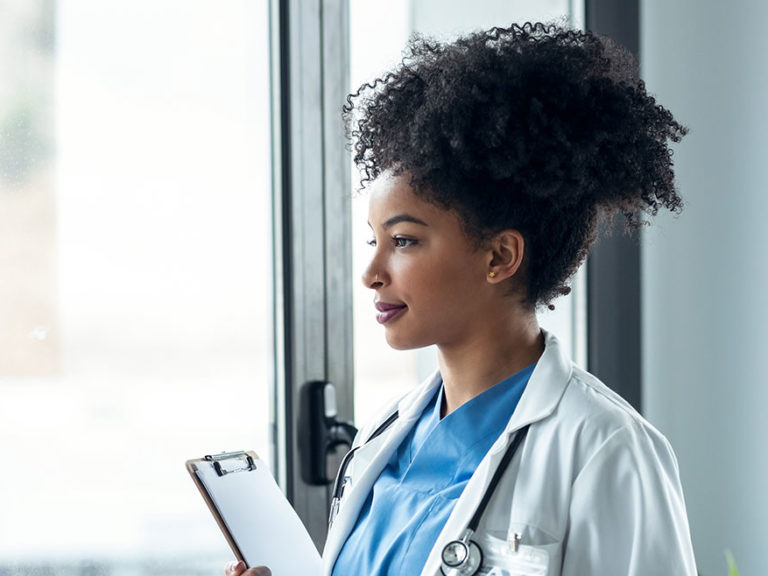 clinical trial nurse looking out window