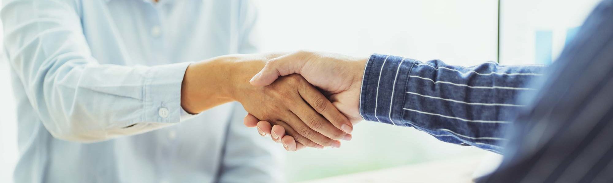 stock photo of doctor and patient shaking hands