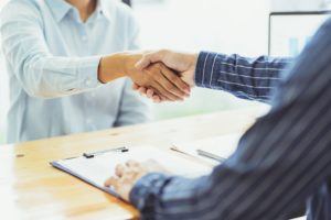 stock photo of doctor and patient shaking hands