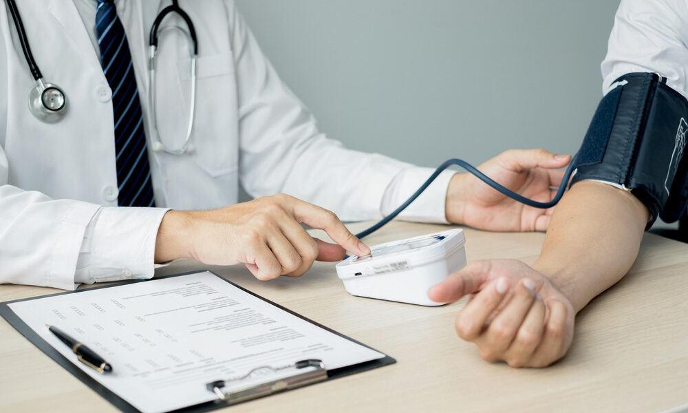 doctor-checking-blood-pressure